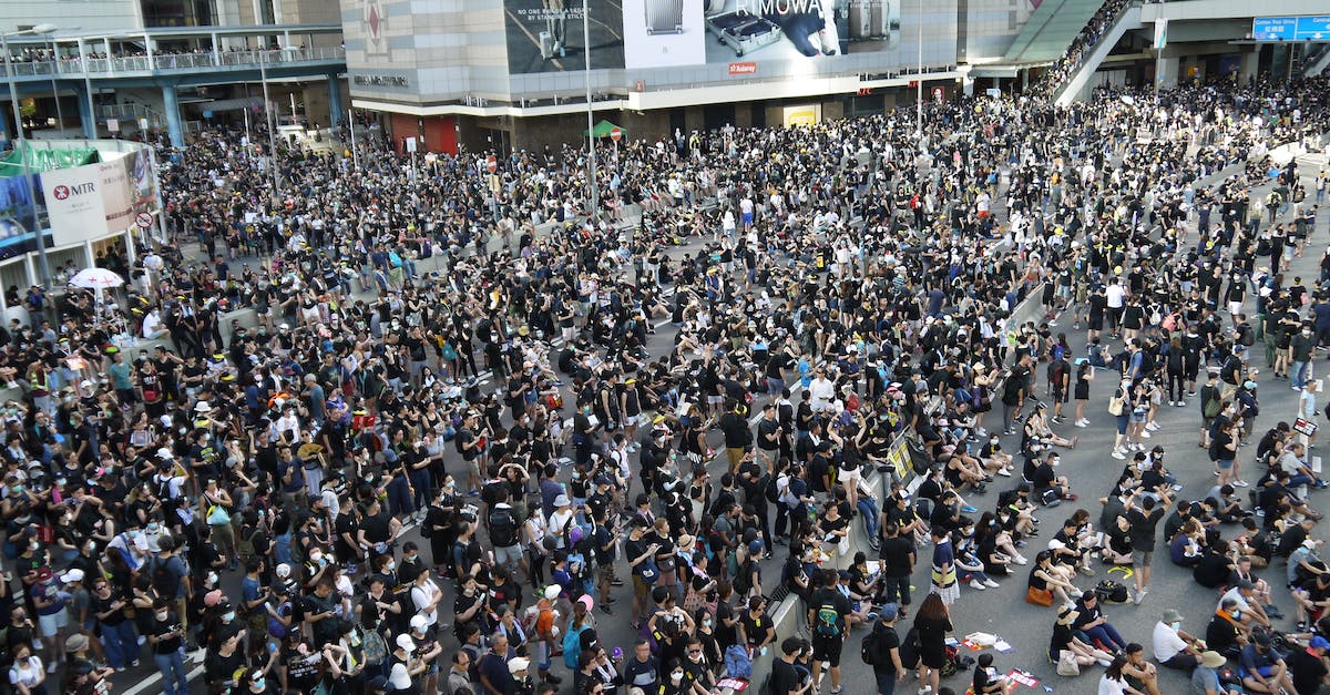 Defend against Biotic Attack in Mass Effect 1 - High angle of crowded street of city downtown gathered together to defend and resist Government