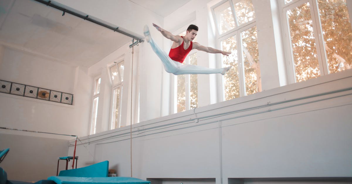 Defending a gym with a high CP rare pokemon that has had its name changed? - Young professional gymnast jumping on trampoline