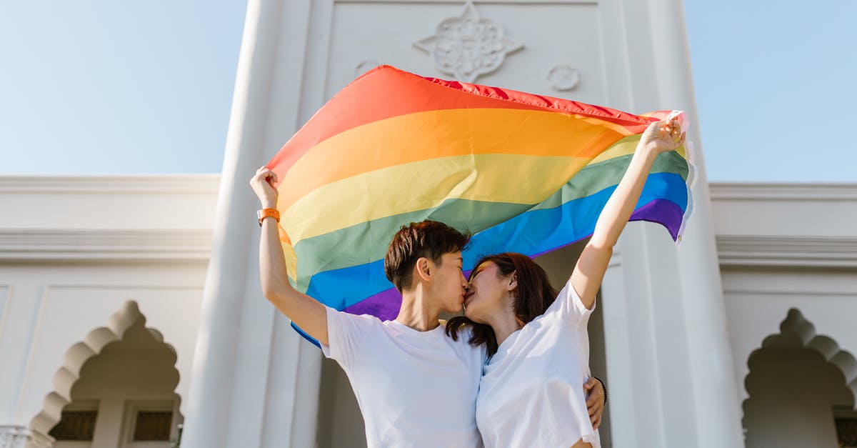 Deino before the E4 - Two Lesbian Girls Kissing Each Other and Carrying Rainbow Flag Deino before the E4 - Two Lesbian Girls Kissing Each Other and Carrying Rainbow Flag
