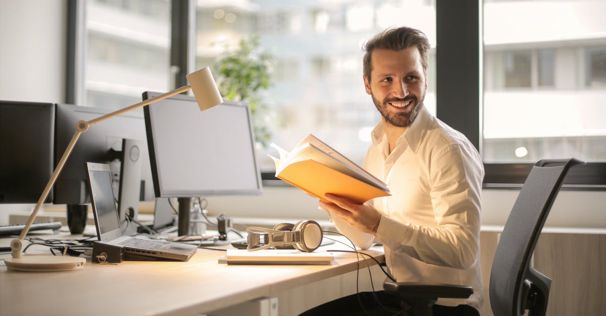 Desktop Windows Manager causes severe game lag - Photo of Man Holding a Book Desktop Windows Manager causes severe game lag - Photo of Man Holding a Book
