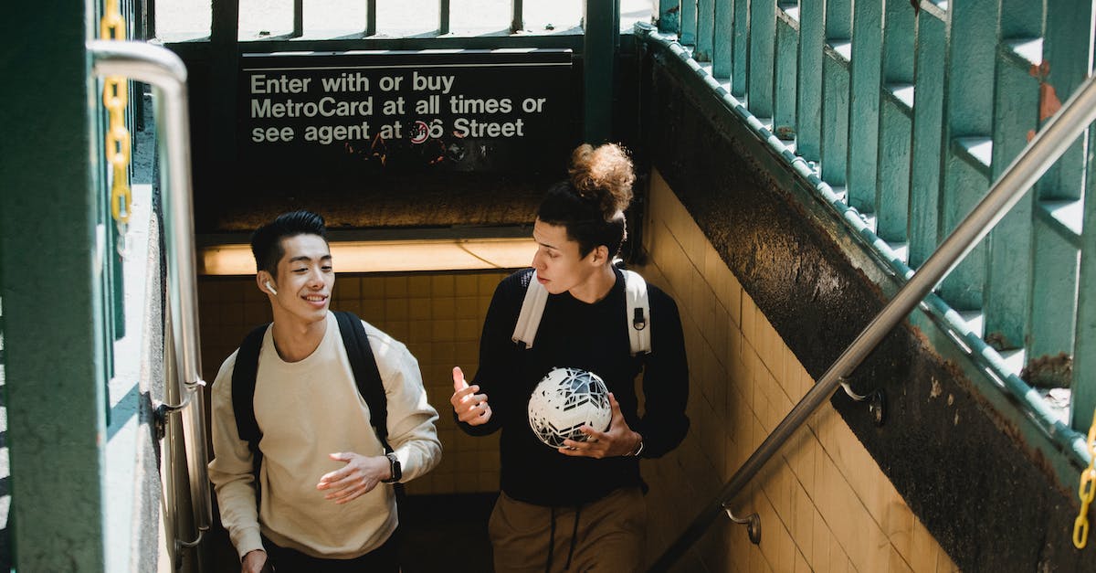 Destiny Chat Exit - Young students chatting while leaving subway Destiny Chat Exit - Young students chatting while leaving subway