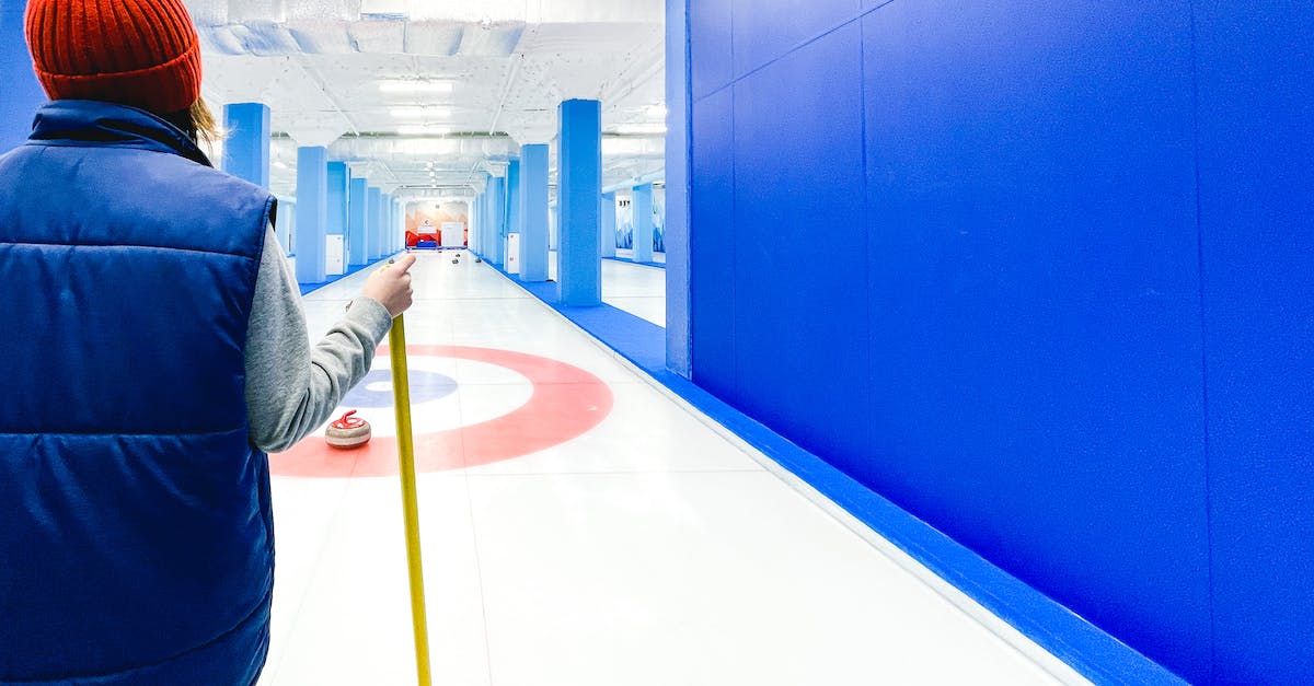 Detect if player clicks with item such as stick or blaze rod? - Back View of Person in Blue Vest Wearing Red Beanie Hat Standing on Curling Rink Detect if player clicks with item such as stick or blaze rod? - Back View of Person in Blue Vest Wearing Red Beanie Hat Standing on Curling Rink
