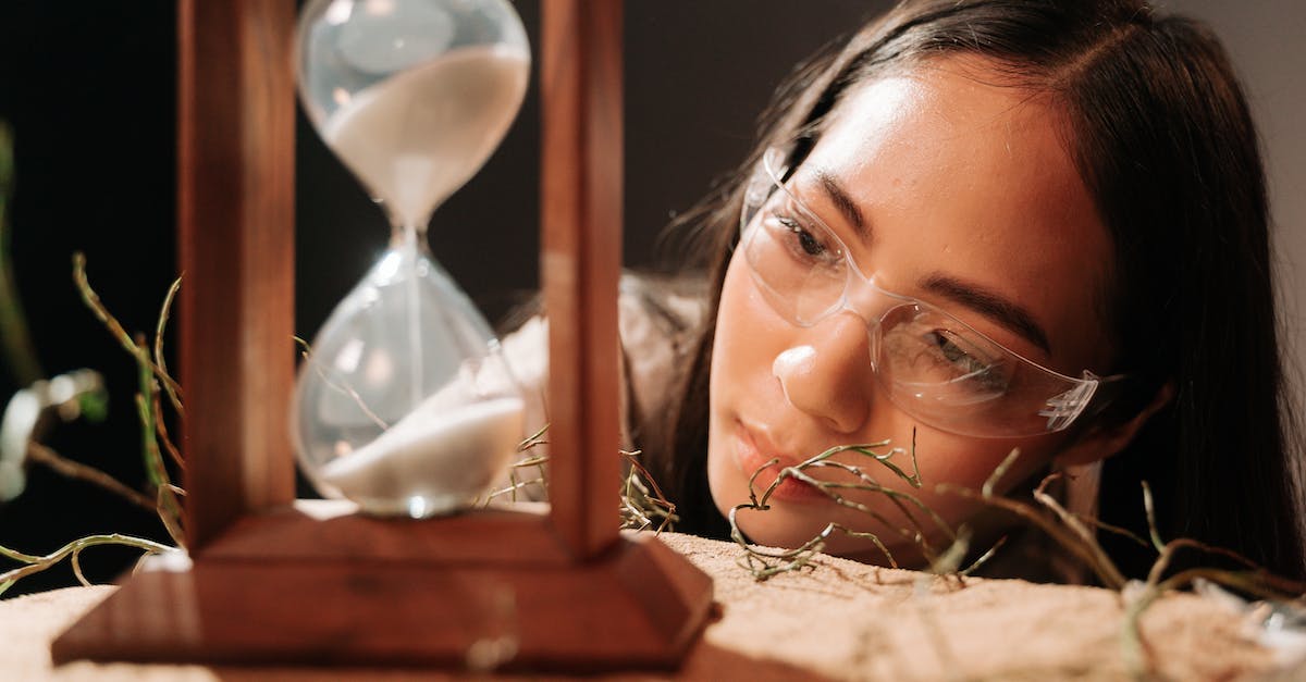 Diana Q-R time frame? - Woman Looking on an Hourglass on a Wooden Frame