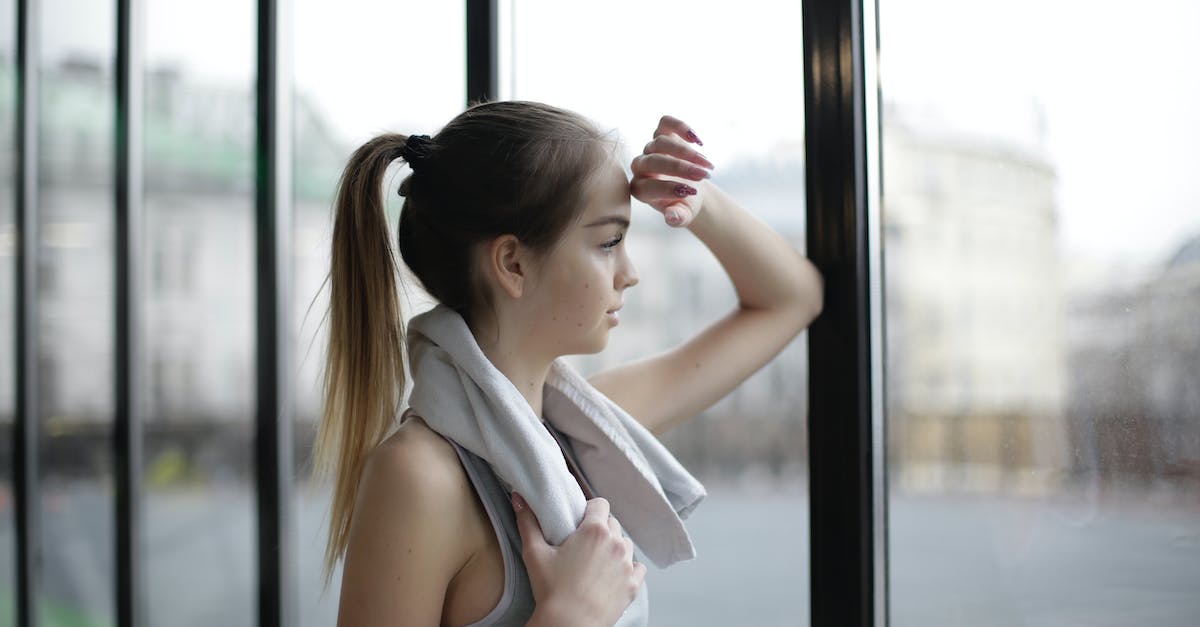 Did Morinth actually think Shepard is strong-willed enough? - Side view of thoughtful young female athlete in sportswear with towel around neck standing near window with elbow on glass and looking away pensively while resting after training in modern gym Did Morinth actually think Shepard is strong-willed enough? - Side view of thoughtful young female athlete in sportswear with towel around neck standing near window with elbow on glass and looking away pensively while resting after training in modern gym