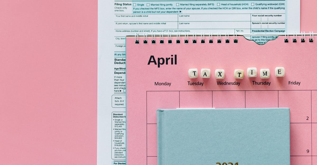 Did not working after year and a half - Tax Return Form and 2021 Planner on Pink Surface Did not working after year and a half - Tax Return Form and 2021 Planner on Pink Surface
