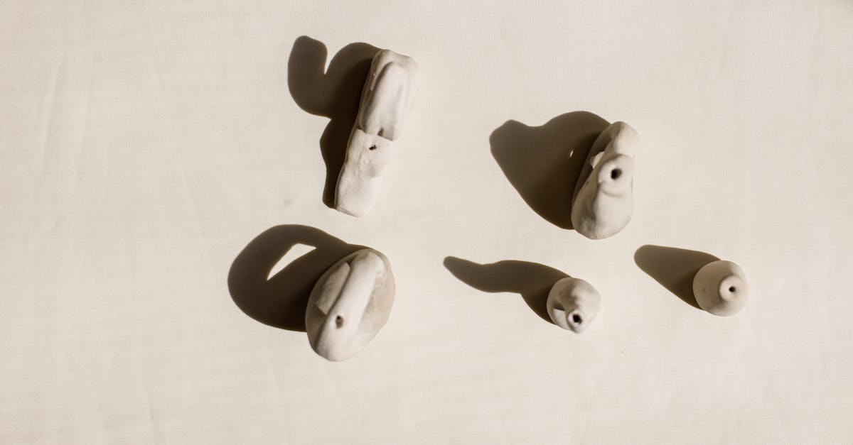 Difference between different ammunition - White Rabbit Figurine on White Surface