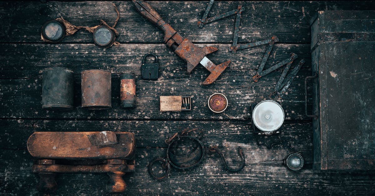 Difference in item drop between old and new characters - Old tools on wooden surface