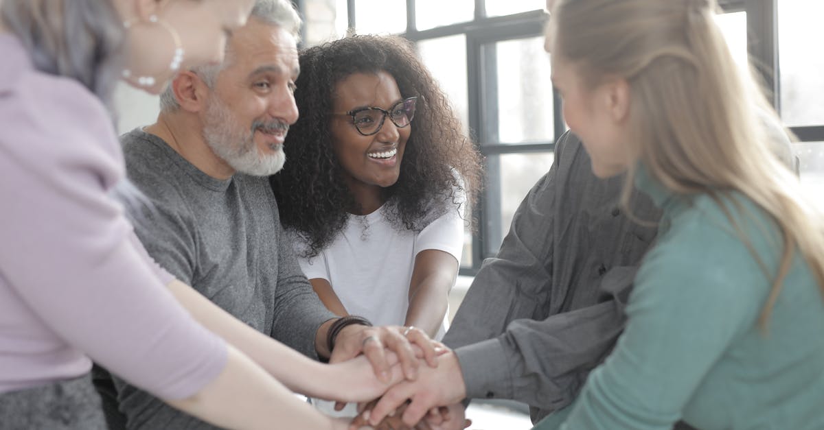 Discord-Minecraft integration - Content multiethnic colleagues joining hands after coming to agreement Discord-Minecraft integration - Content multiethnic colleagues joining hands after coming to agreement