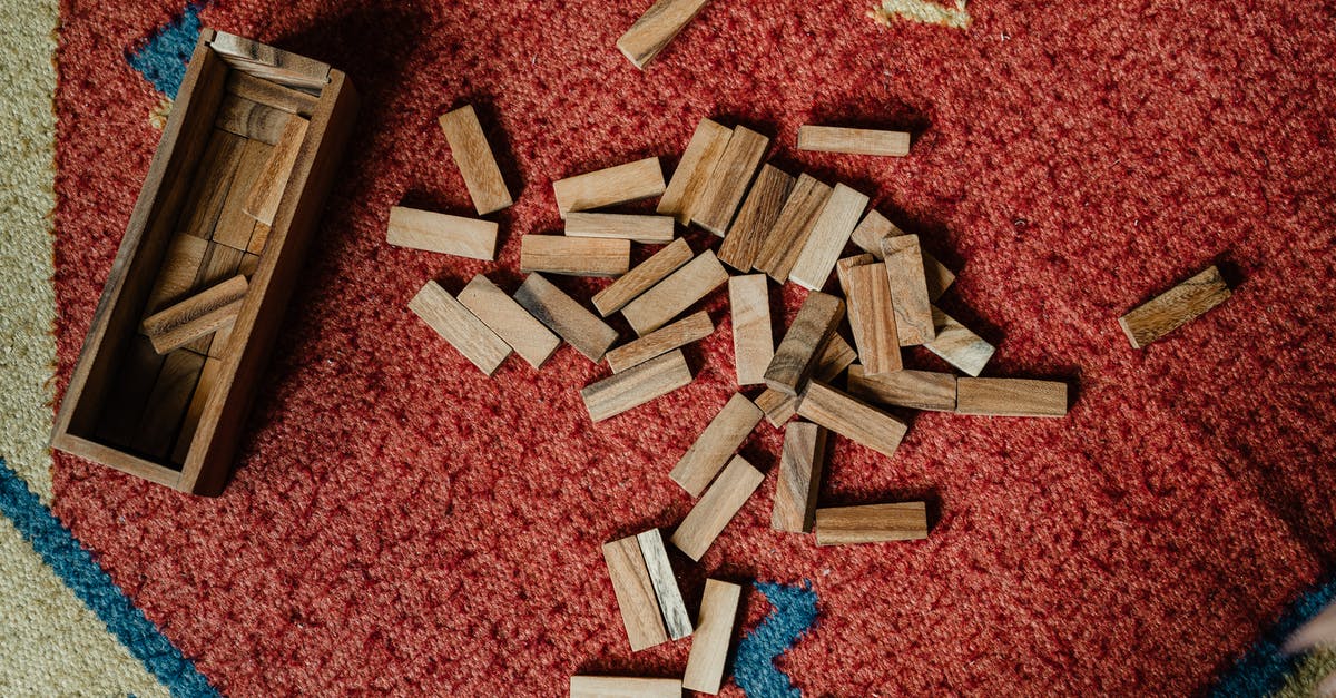 Do all end game builds in Diablo 3 use set items? - Top view of wooden box and pile of blocks for playing in jenga tower game arranged on floor carpet