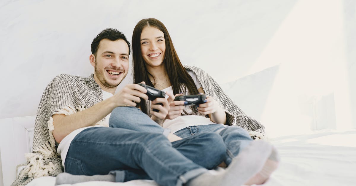 Do all Playstation consoles use 3.3V for controller port signalling? - Happy couple playing game console while lying on bed