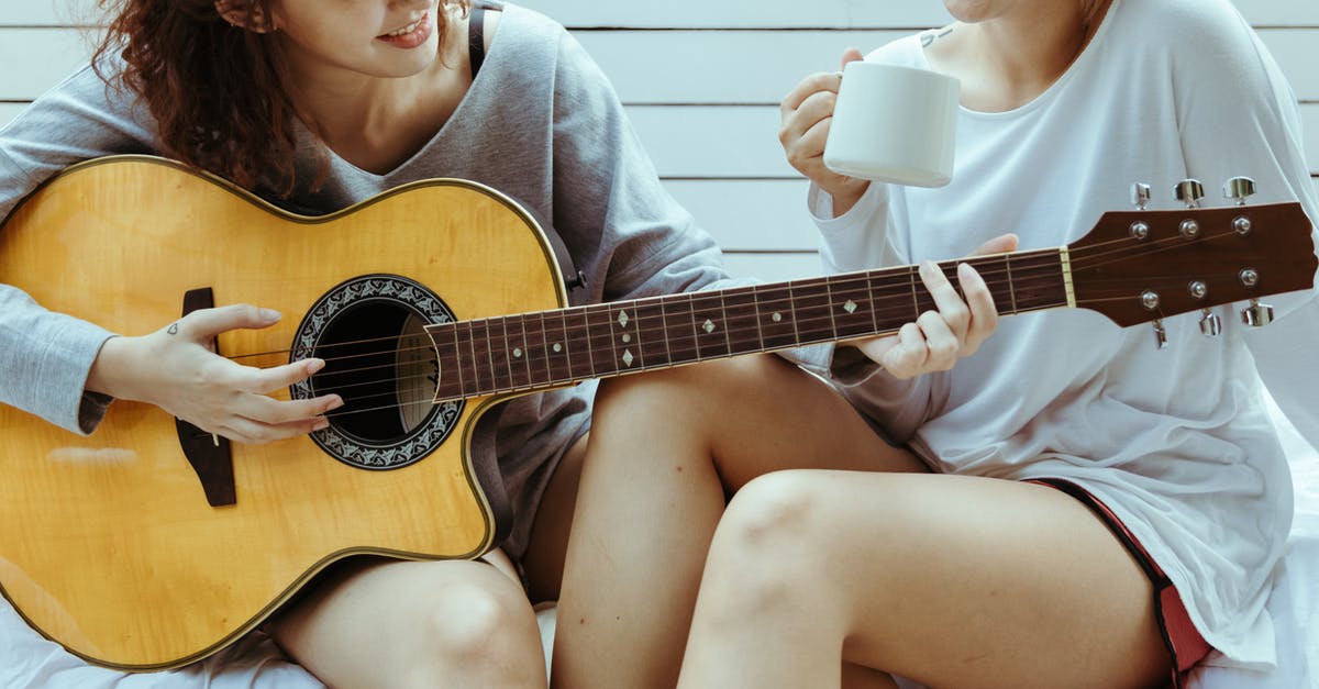 Do any heroes share romantic relationships with other heroes? - Crop female friends in tee shirts playing on guitar and chatting while sitting on white terrace with tea Do any heroes share romantic relationships with other heroes? - Crop female friends in tee shirts playing on guitar and chatting while sitting on white terrace with tea