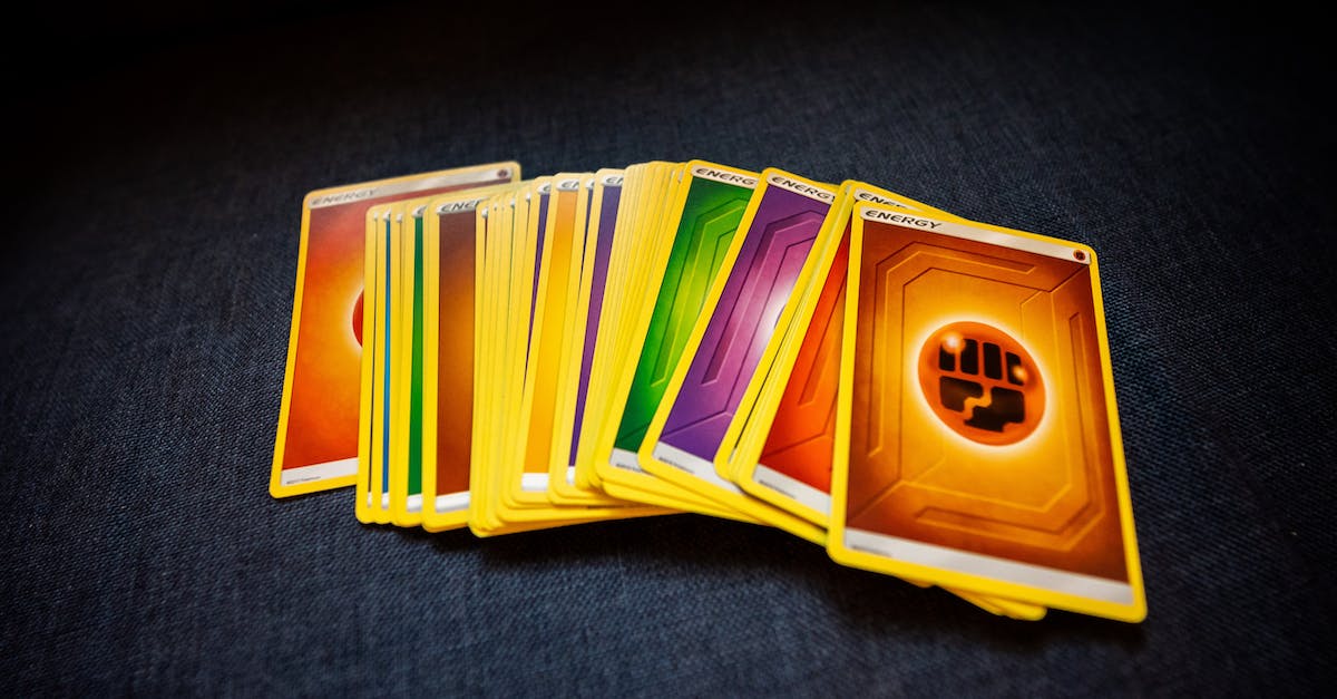 Do arena entrances or card pack prices ever change? - From above of colorful pack of trading cards for game placed on gray surface