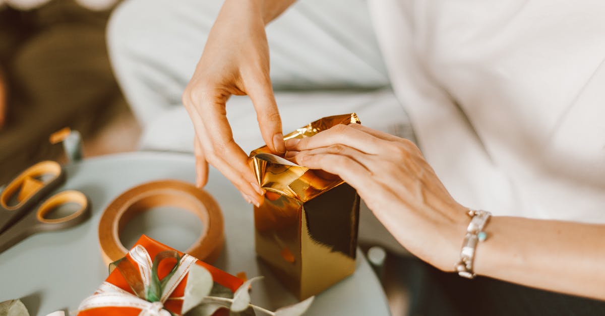 Do cats bring gifts according to their power? - Woman Wrapping Presents Boxes