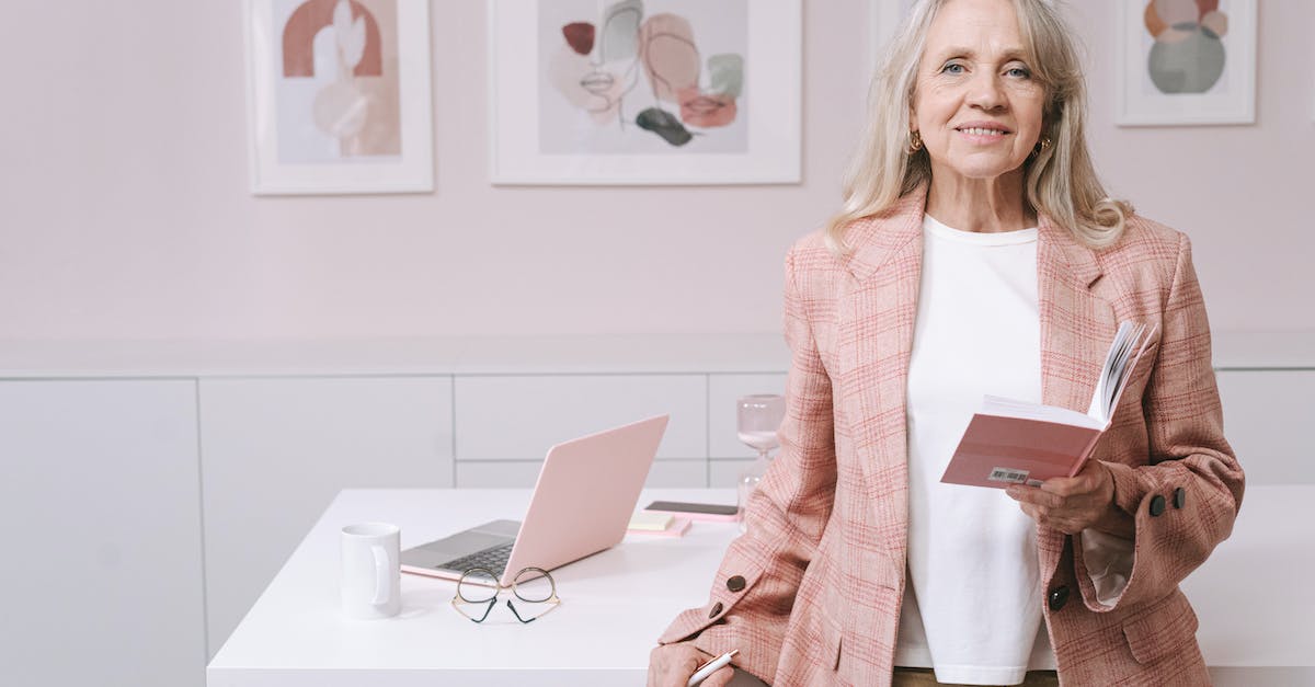 Do citizens migrate closer to their workplace within the town? - An Elderly Woman in Pink Blazer Smiling while Holding a Book Do citizens migrate closer to their workplace within the town? - An Elderly Woman in Pink Blazer Smiling while Holding a Book