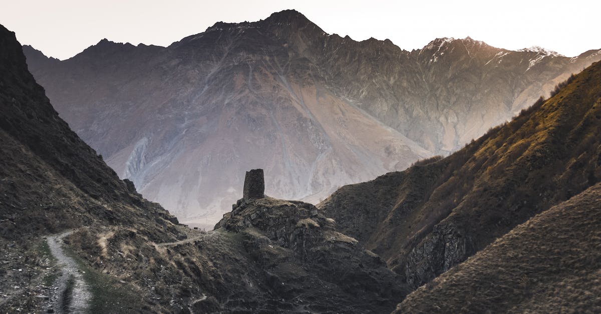 Do damaging spells affect Hidden Tesla towers while the towers are still hidden? - Brown Rocky Mountain Under White Sky