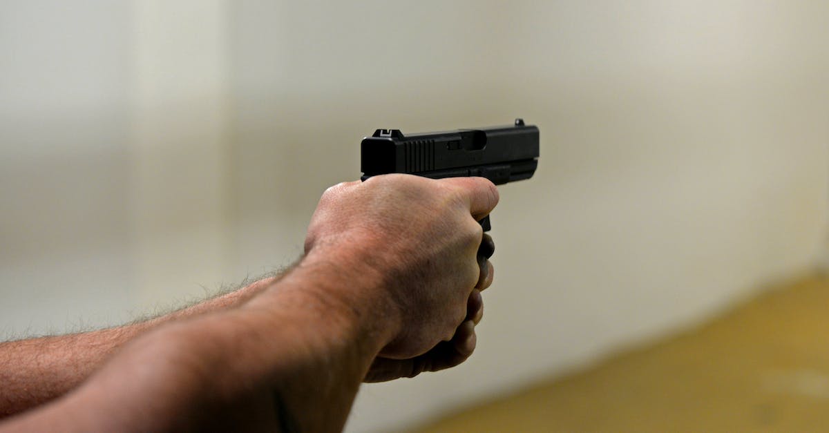Do Defense Drones shoot down Flak projectiles? - Crop man firing pistol in shooting range