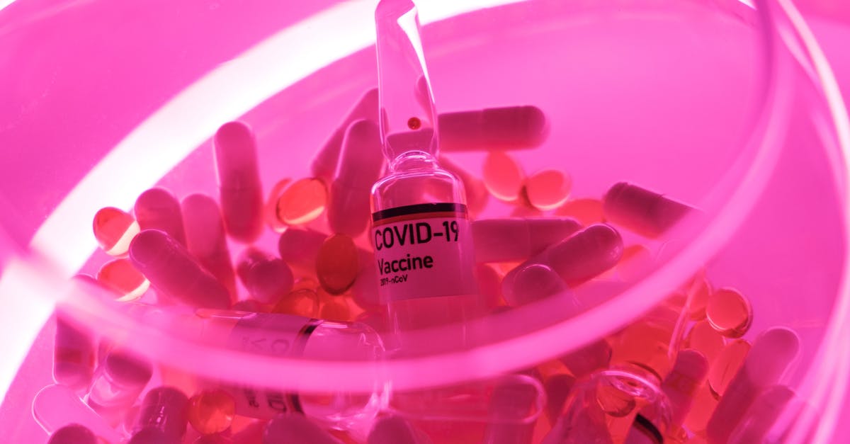 Do different foods heal different amounts of HP? - Glass bowl with capsules and vaccine for coronavirus