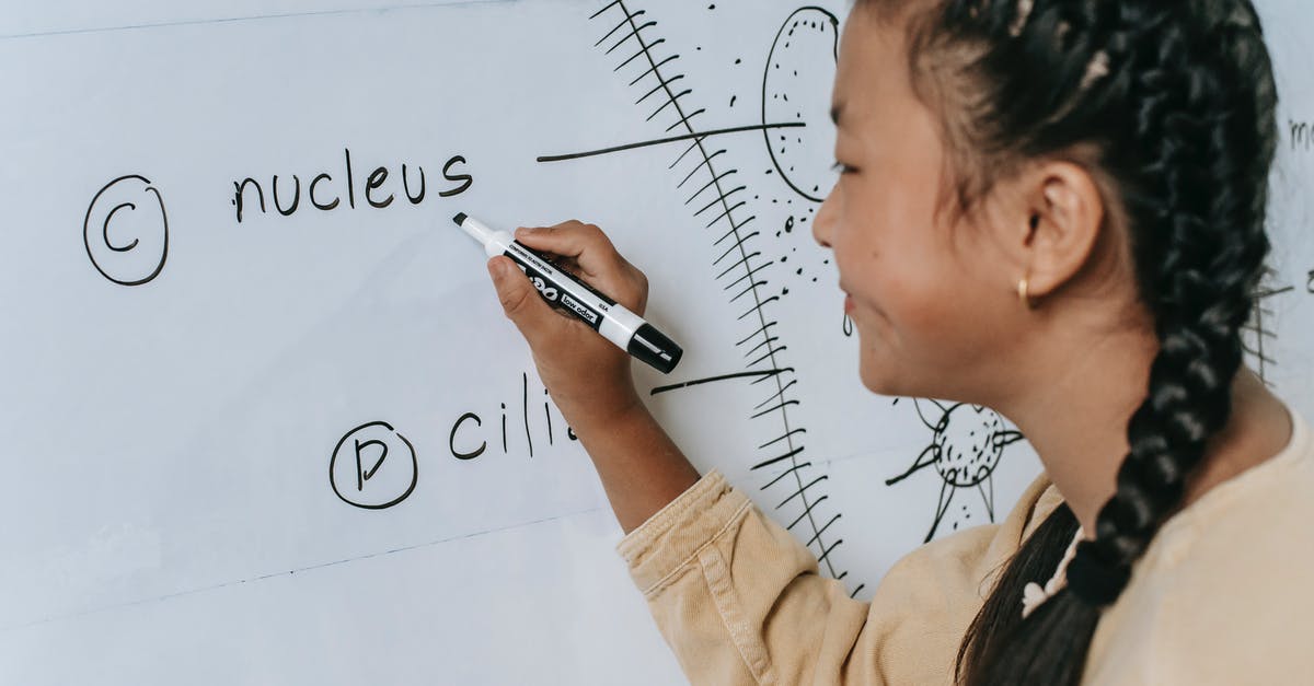 Do Experience modifiers affect the amount of experience shared by the Exp. Share? - Side view of ethnic teenage writing words on whiteboard and studying biology in classroom