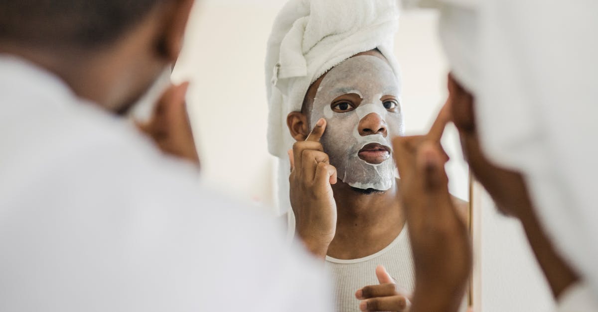 Do Father's facial features change? - Men Looking in Mirror Doing Facial Procedures