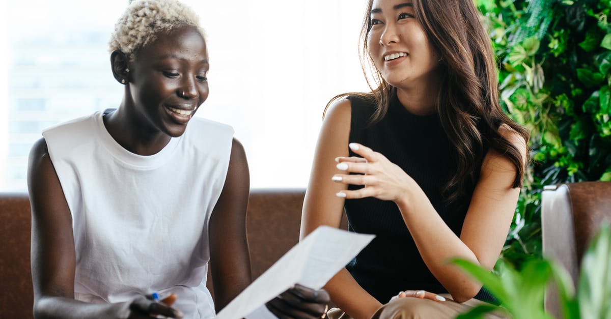 Do friendly kills reset your scorestreak meter? - Multiethnic happy smiling women checking papers while speaking in comfortable conference hall in daytime