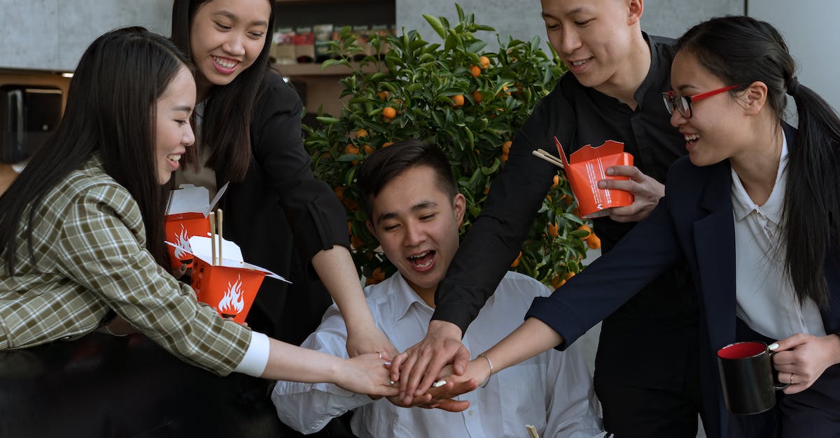 Do gathering skills Stack? - A Group of People Stacking Hands while Holding Takeout Boxes
