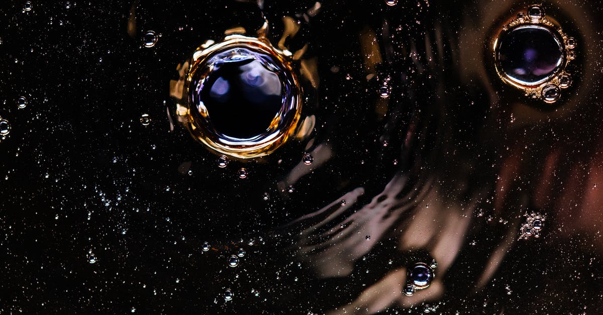 Do guards always spill the juicy details first? - Bubbles and ripples on dark drink surface