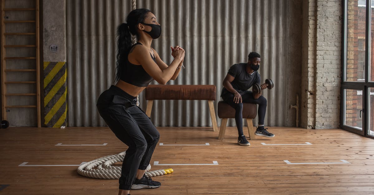 Do harder floors prevent tunneling? - Black sportspeople in fabric masks working out in gym