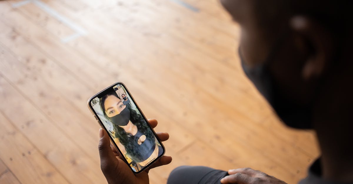 Do harder floors prevent tunneling? - Crop black man talking to girlfriend in mask on smartphone