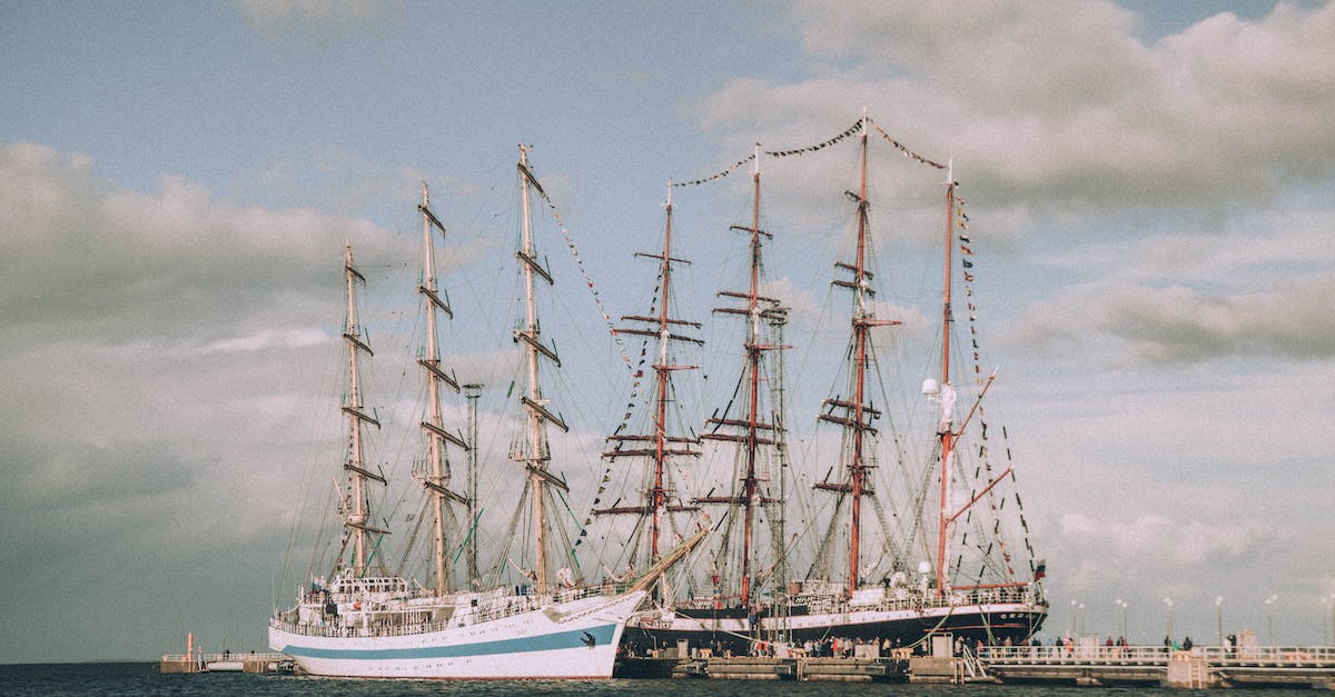 Do higher levels have a larger view distance - Sailing ships near pier with people under cloudy sky Do higher levels have a larger view distance - Sailing ships near pier with people under cloudy sky