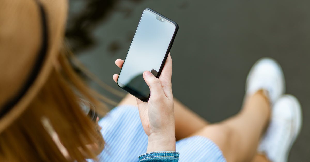 Do I have to look at the screen all the time? - Person Holding Smartphone White Sitting