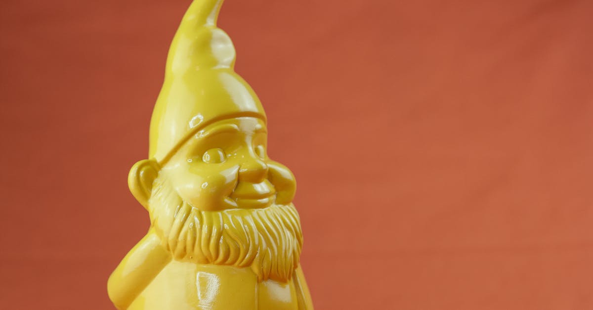 Do I have to make light sources in Dwarf Fortress? [closed] - Closeup yellow figurine on red background
