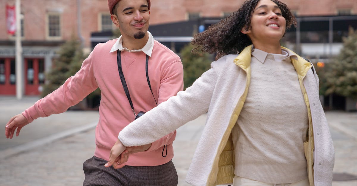 Do I have to run SKSE to launch Skyrim every time? - Cheerful young Hispanic couple in stylish clothes holding hands and running on city square during romantic date Do I have to run SKSE to launch Skyrim every time? - Cheerful young Hispanic couple in stylish clothes holding hands and running on city square during romantic date