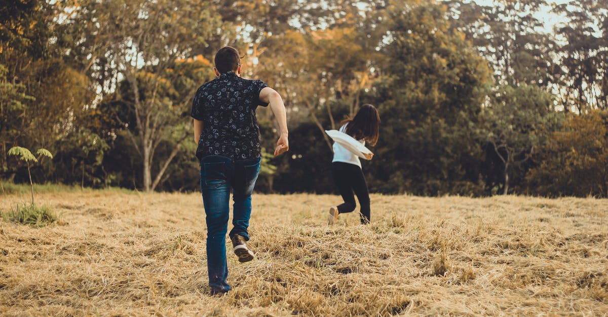 Do I need fast reflexes to play the Telltale game "Game of Thrones"? - Unrecognizable couple running on meadow in park Do I need fast reflexes to play the Telltale game "Game of Thrones"? - Unrecognizable couple running on meadow in park