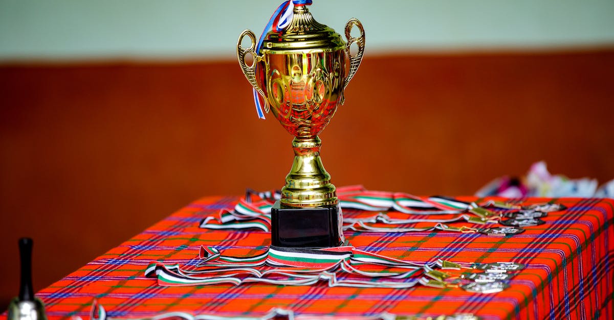 Do I need gold medals on all missions to get 100%? - A Gold Trophy and Medals on a Table With a Checkered Cloth Do I need gold medals on all missions to get 100%? - A Gold Trophy and Medals on a Table With a Checkered Cloth