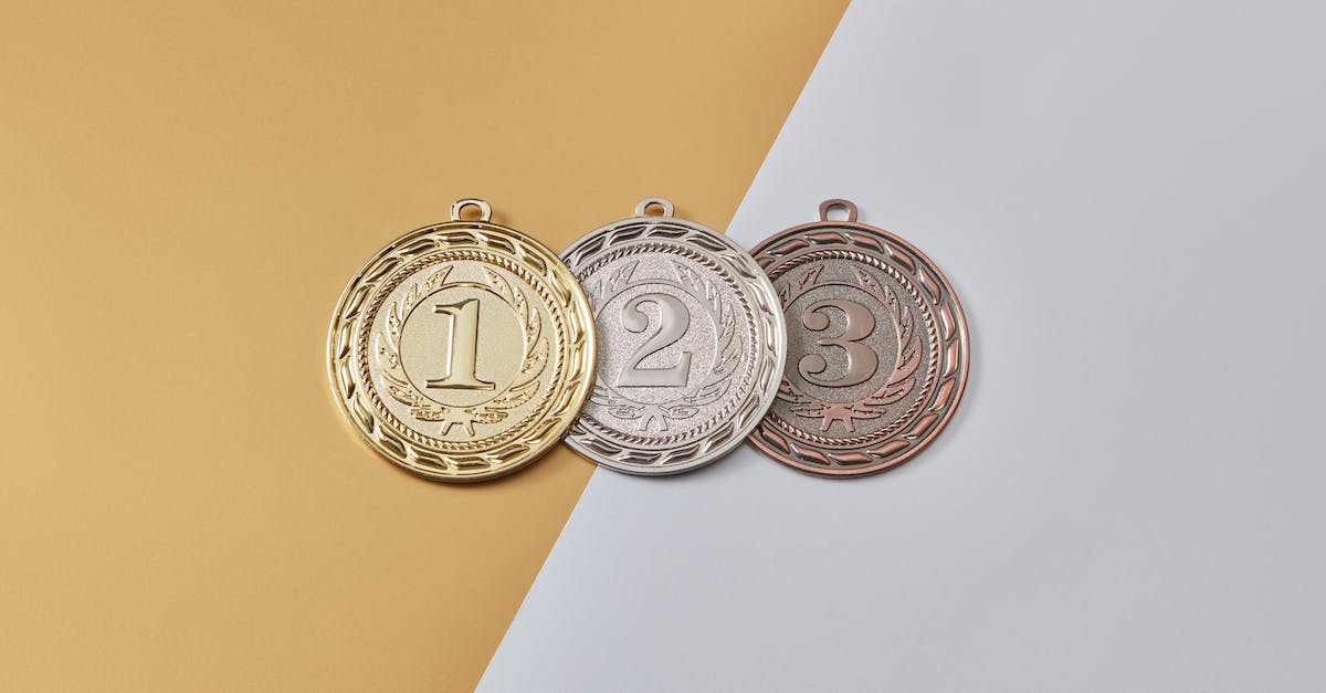 Do I need gold medals on all missions to get 100%? - Medals on a Yellow and Gray Surface Do I need gold medals on all missions to get 100%? - Medals on a Yellow and Gray Surface