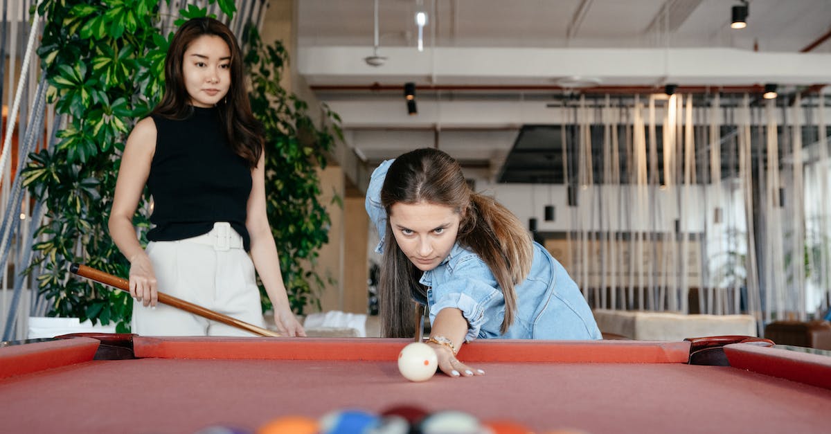 Do I need the .cue file to play ps1 games on epsxe - Focused multiethnic friends playing billiard together in spacious room