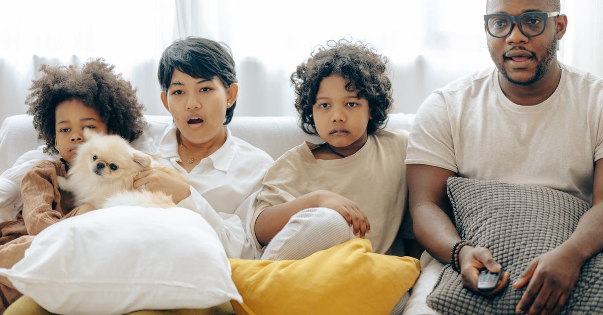 do I need to have played Watch Dogs 1 to understand Watch Dogs 2's storyline? - Interested multiracial family watching TV on sofa together with dog do I need to have played Watch Dogs 1 to understand Watch Dogs 2's storyline? - Interested multiracial family watching TV on sofa together with dog