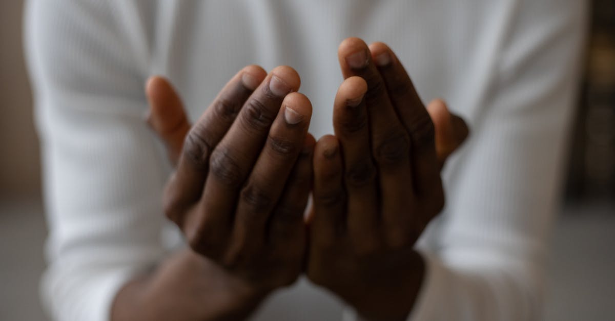 Do Infamy and Holy Mantle synergize together? - Crop black man praying at home Do Infamy and Holy Mantle synergize together? - Crop black man praying at home