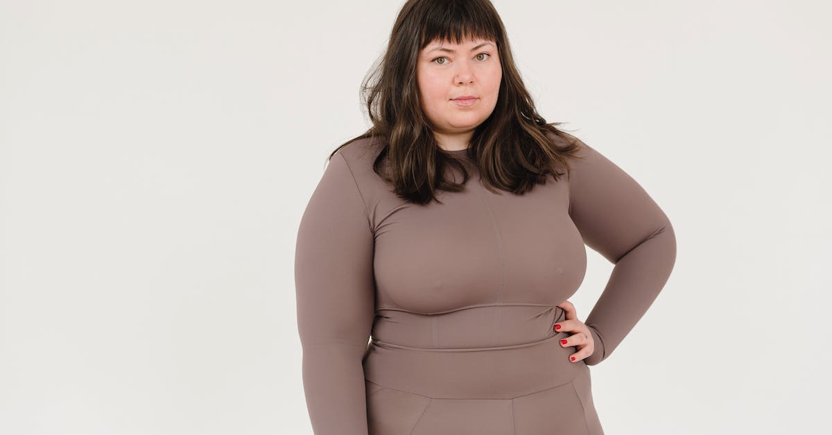 Do large Minecraft servers run on multiple different machines? - Plus size female in activewear keeping hand on waist and looking at camera against white background