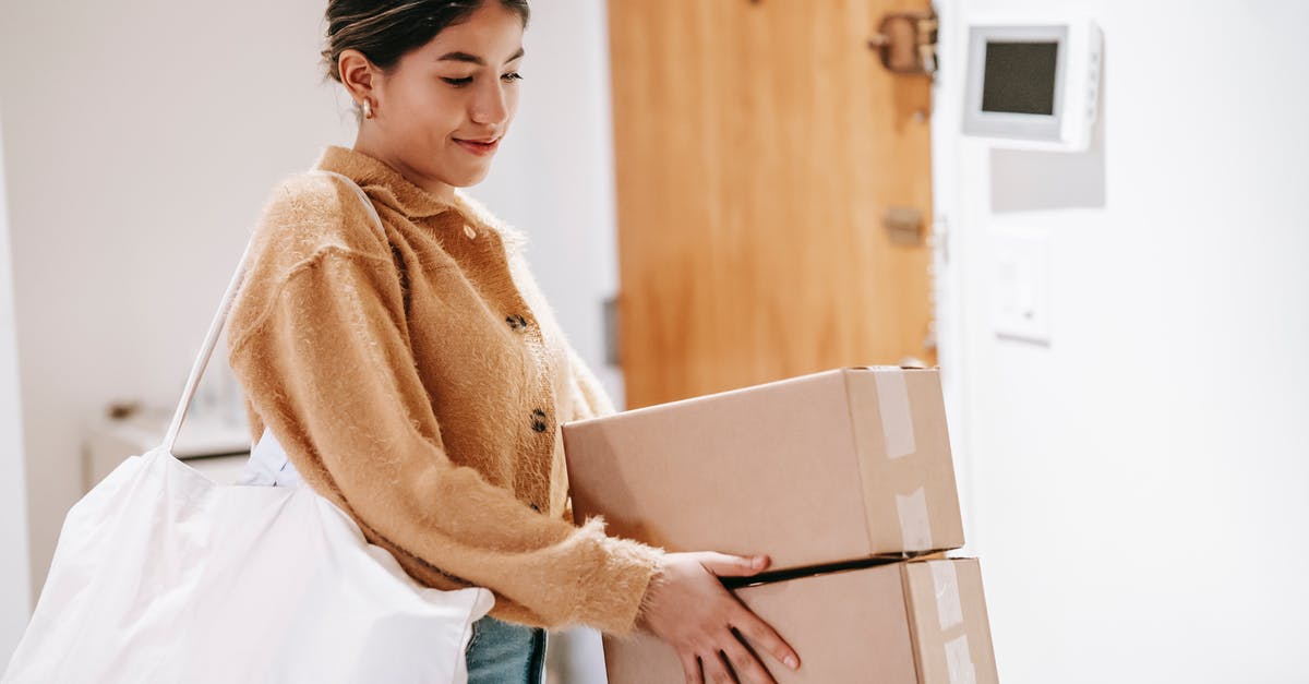Do logistic drones and vessels carry goods roundtrip? - Smiling woman with shopping bag and packed goods Do logistic drones and vessels carry goods roundtrip? - Smiling woman with shopping bag and packed goods