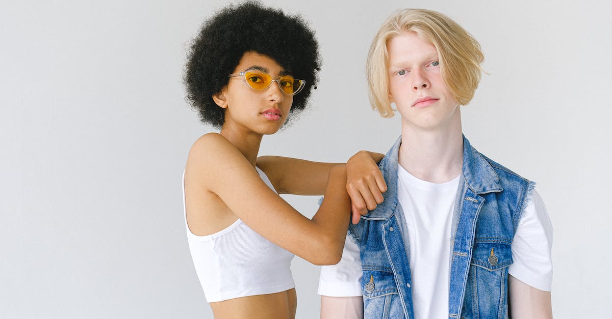 Do non-archery abilities that don't specify melee affect archery? - Young multiracial couple in denim and white wear on white background looking at camera