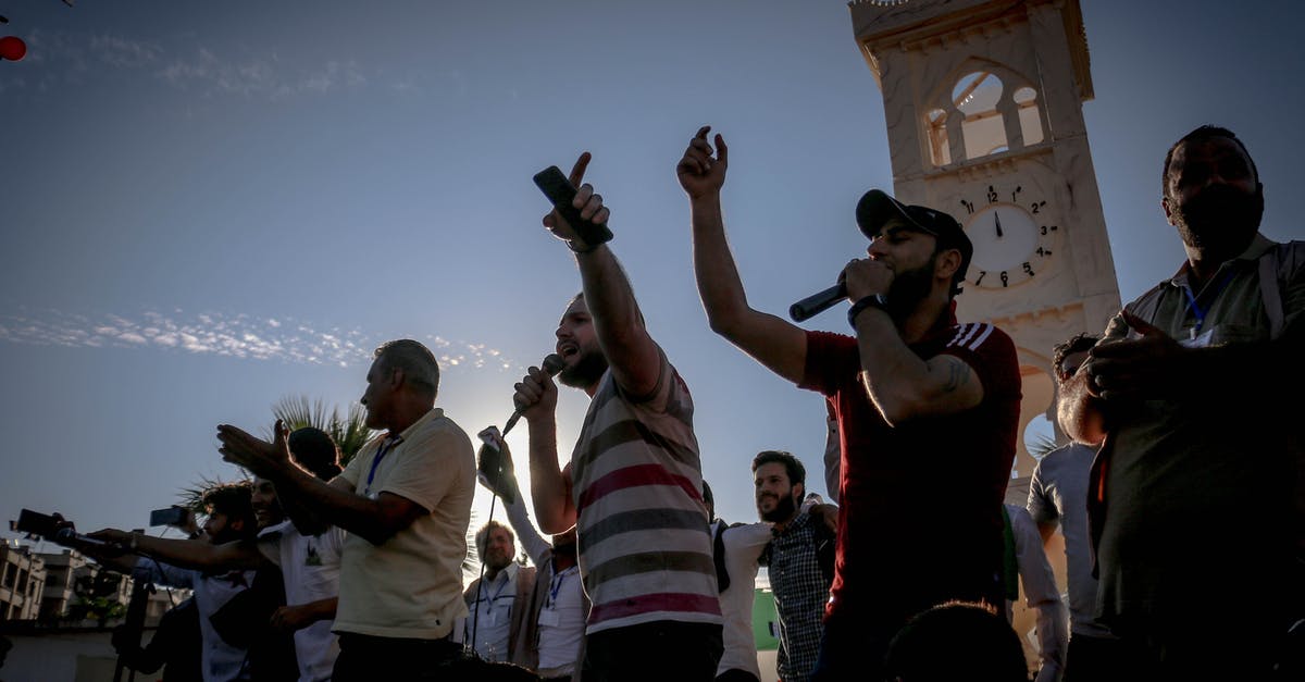 Do party members gain bonuses from using their "story" weapon? - Ethnic men singing songs at event