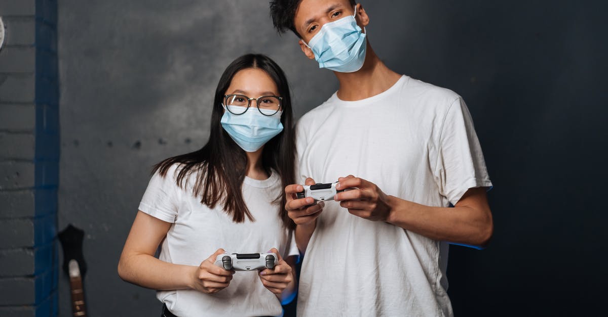 Do PlayStation 2 controllers support USB connections? - A Man and a Woman Holding Playstation Controllers Do PlayStation 2 controllers support USB connections? - A Man and a Woman Holding Playstation Controllers