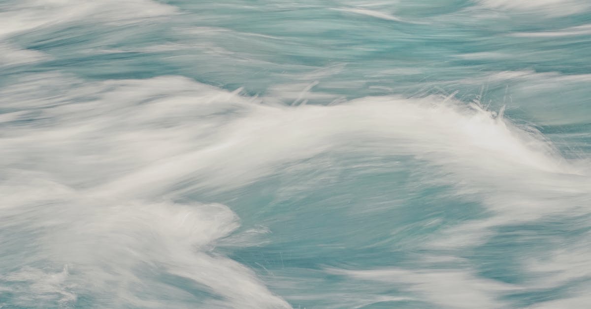 Do Power Items actually reduce Speed EVs? - Abstract background of clear waves of sea rolling fast creating white foam in motion