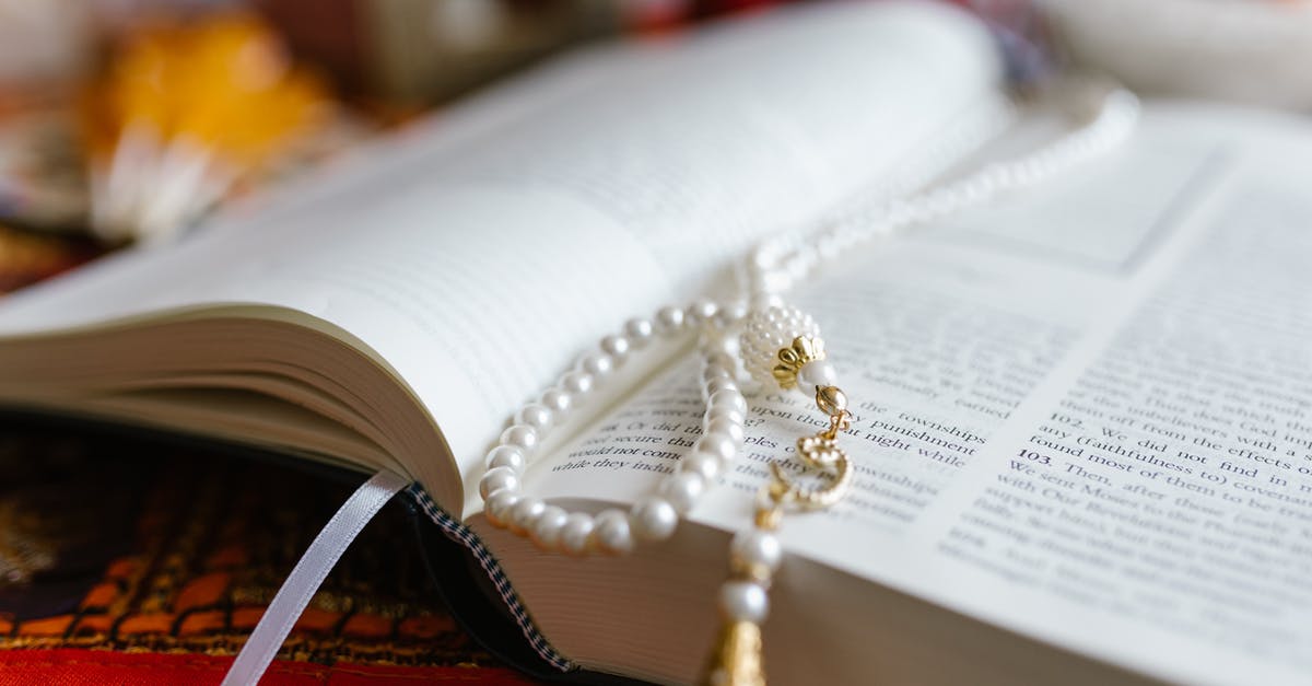 Do Sacred Springs ever replenish? - Gold and Silver Beaded Necklace on White Book Page