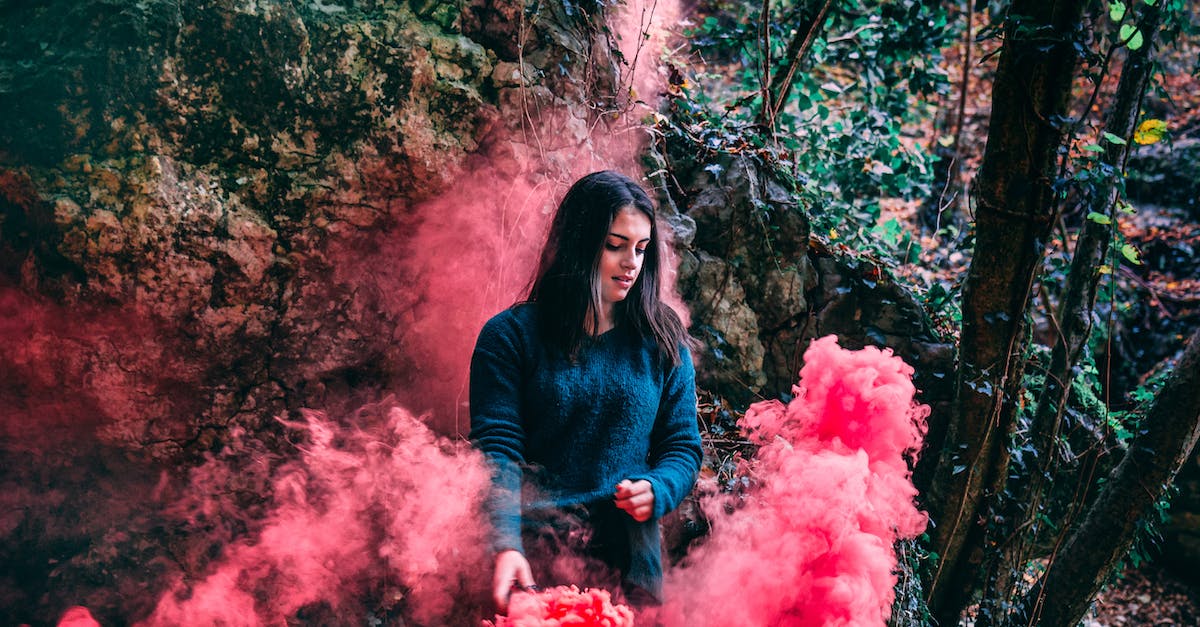 Do smoke grenades do anything in the campaign? - Woman Wearing Blue Long Sleeved Shirt Standing On Pink Smoke