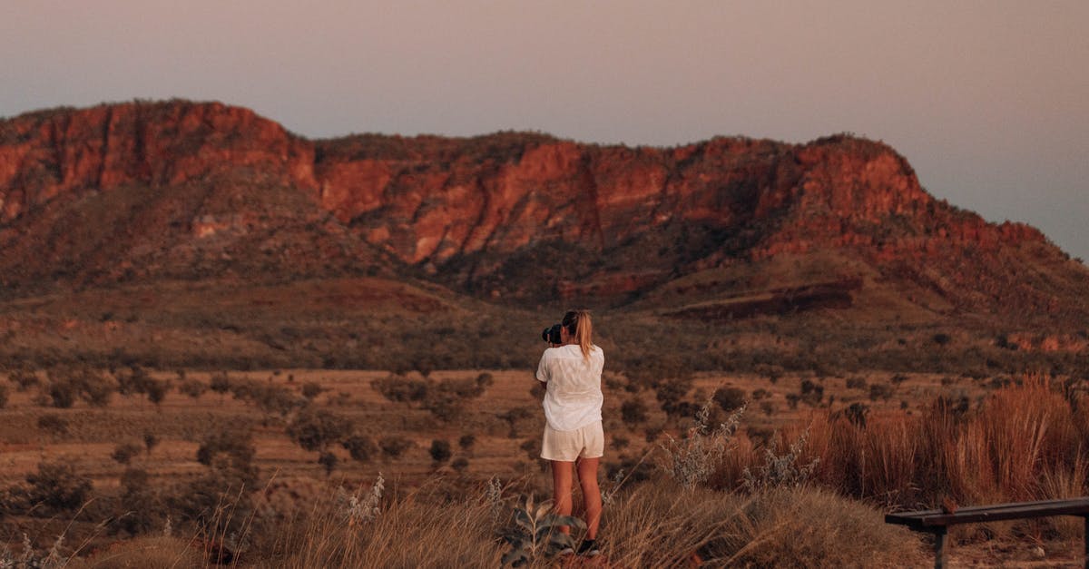 Do some secrets require going back to previous mission? - Woman in White Long Sleeve Shirt Standing on Brown Grass Field