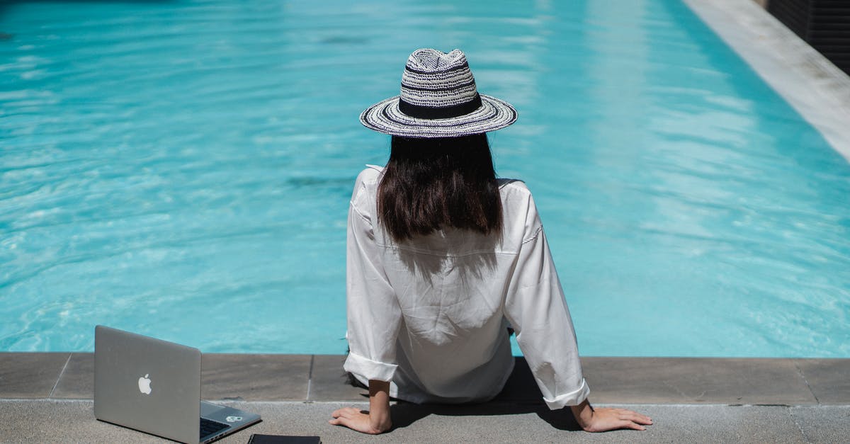 Do speed kills work in A Hat in Time? - Faceless female freelancer resting at poolside after work on laptop