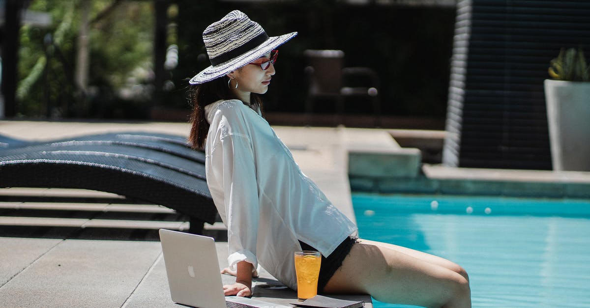 Do speed kills work in A Hat in Time? - Young ethnic woman resting at poolside after distance work on laptop