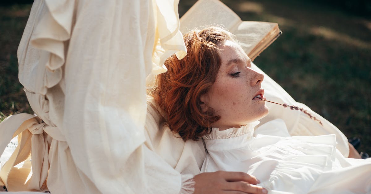 Do spells persist past transmigration? [duplicate] - Women in Old-Fashioned Clothing on Picnic Blanket in Park